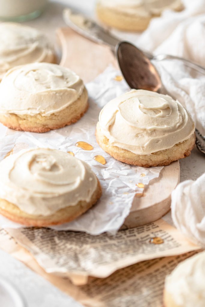 perfect fluffy buttery sugar cookies topped with maple buttercream rosting